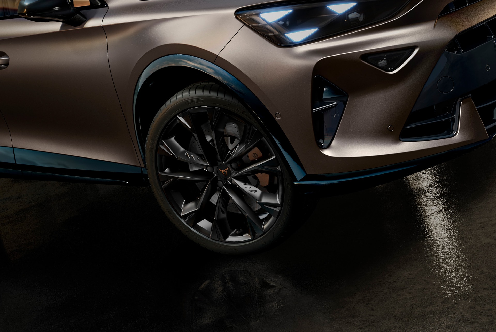 cupra-formentor-close-up-of-alloy-wheel-and-part-of-bumper-parked-in-an-dark-environment